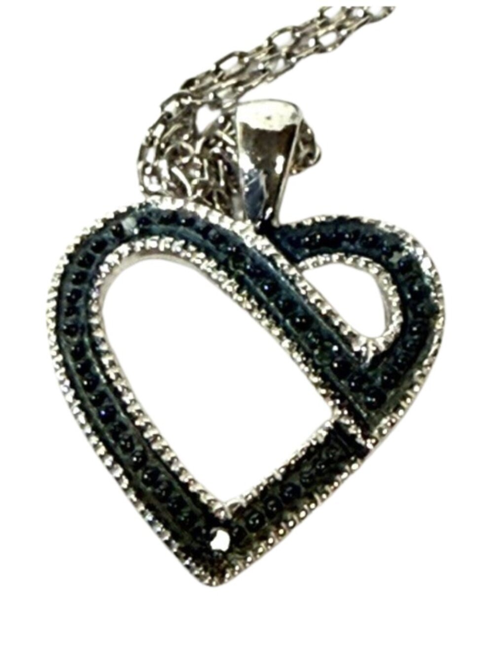 Sterling silver and blue gemstone heart pendant necklace.